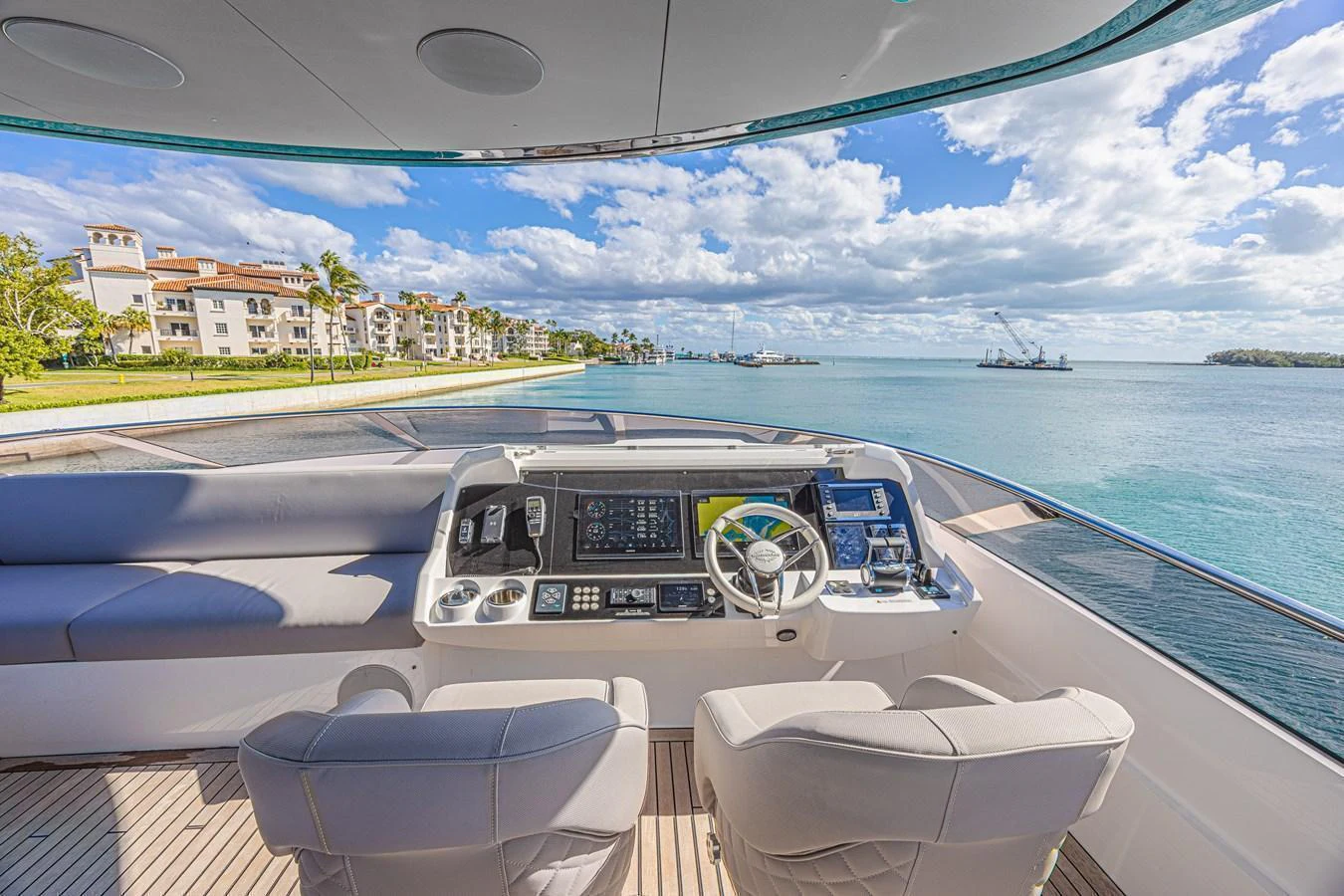 The helm station offers a panoramic view of the serene waters and luxurious surroundings. aboard HIDEOUT Yacht for Sale