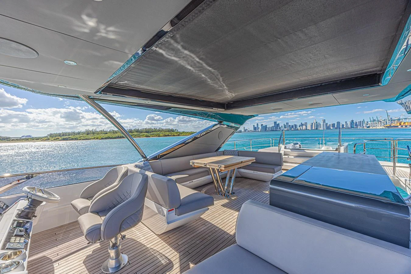 The flybridge offers a spacious and luxurious outdoor area with ample seating and stunning views. aboard HIDEOUT Yacht for Sale