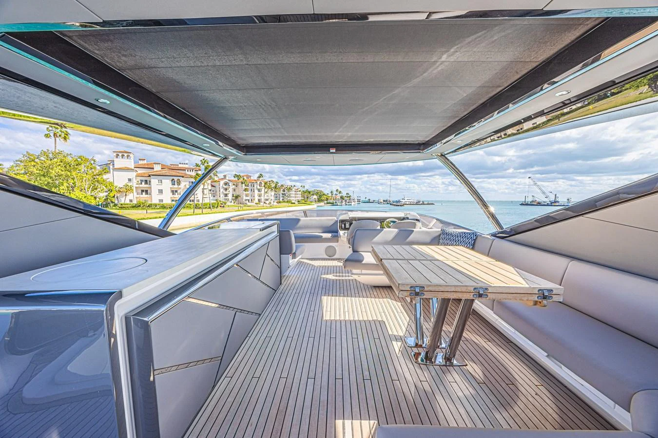 The aft deck offers a spacious and stylish area for relaxation and socializing with a stunning view. aboard HIDEOUT Yacht for Sale