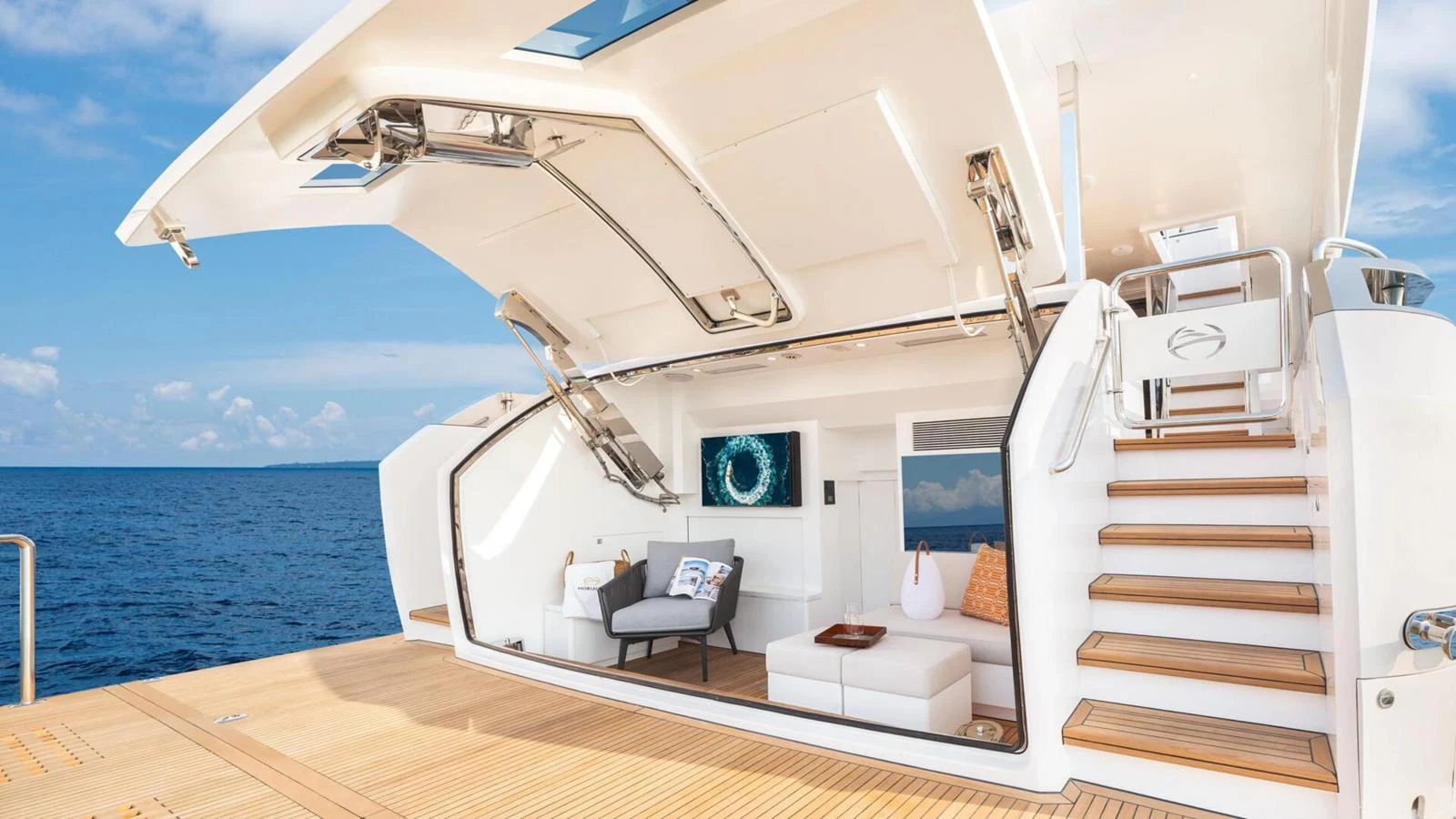 The beach club offers a luxurious space for relaxation with direct access to the sea. aboard HAPPY HEART Yacht for Sale