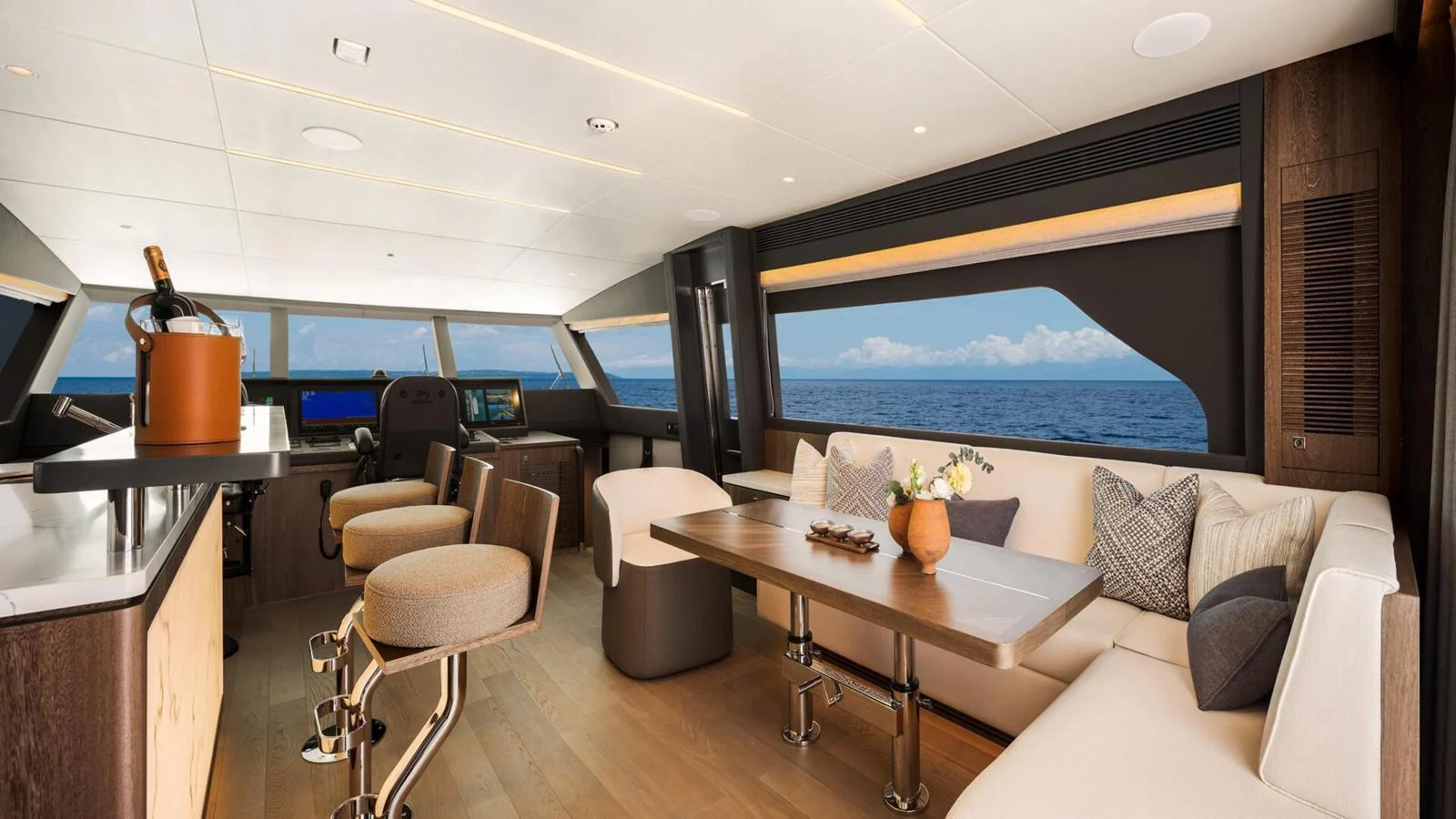 The salon offers a spacious and elegant area with panoramic ocean views. aboard HAPPY HEART Yacht for Sale