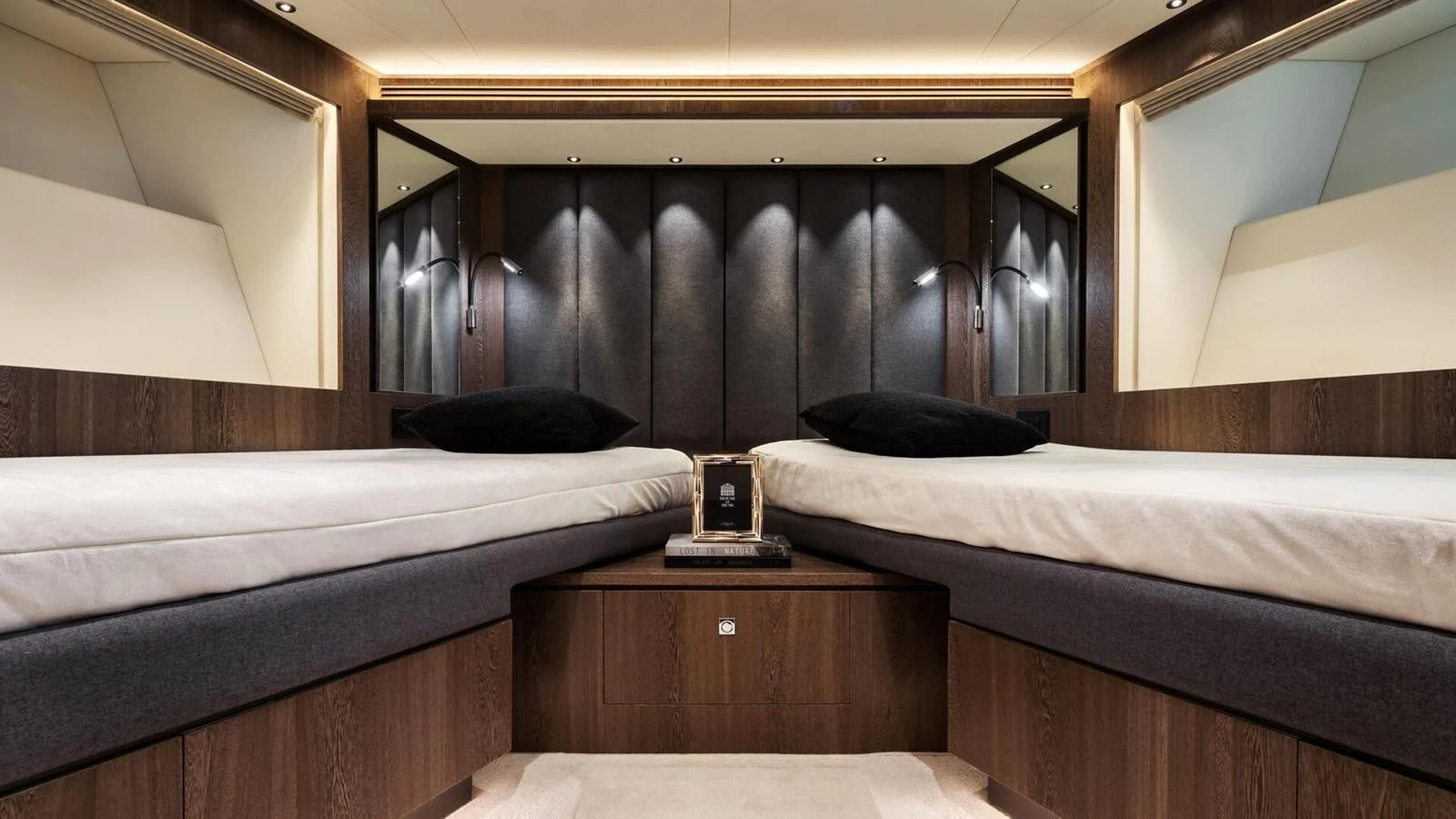 This elegant stateroom features twin beds with a sophisticated and modern design. aboard HAPPY HEART Yacht for Sale