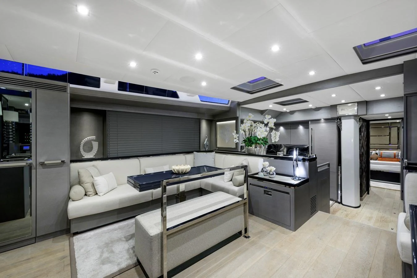 The yacht's salon features a modern and elegant design with ample seating and sophisticated decor. aboard MISHI Yacht for Sale