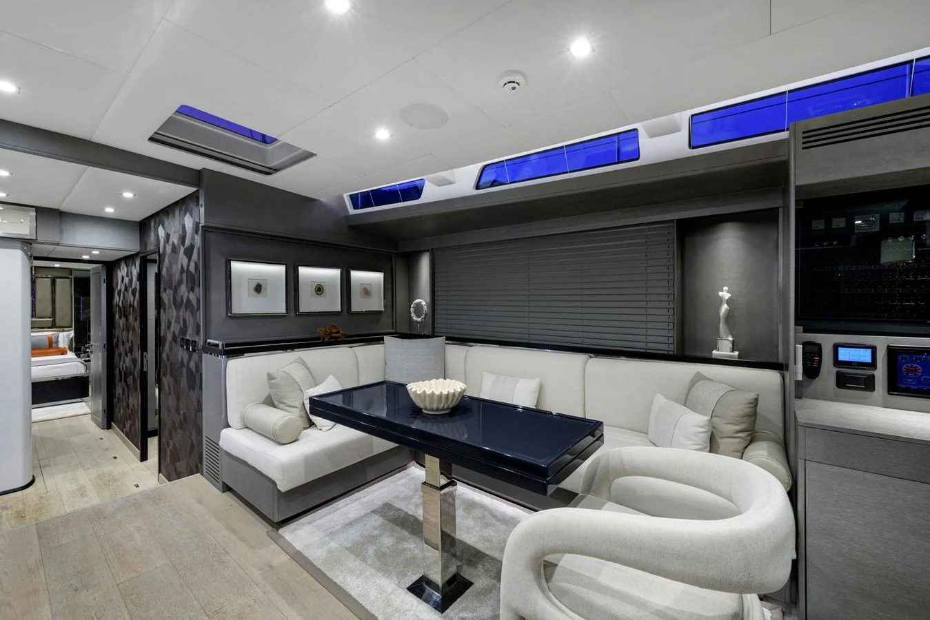 The yacht's salon features a stylish and modern seating area with elegant decor. aboard MISHI Yacht for Sale
