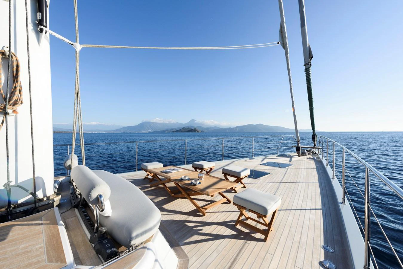 The sundeck offers a spacious and serene area with lounge chairs and a stunning ocean view. aboard MISHI Yacht for Sale