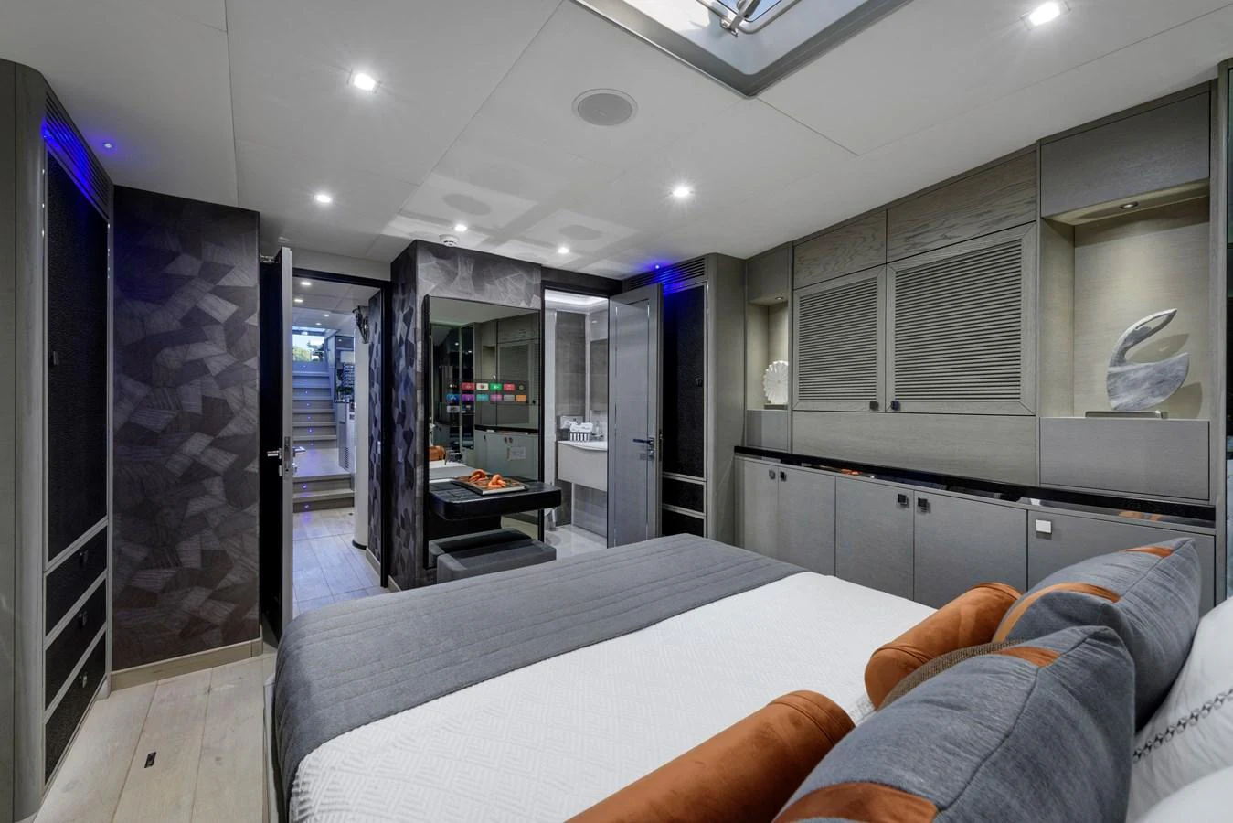 The stateroom features a modern design with ample storage and luxurious bedding. aboard MISHI Yacht for Sale