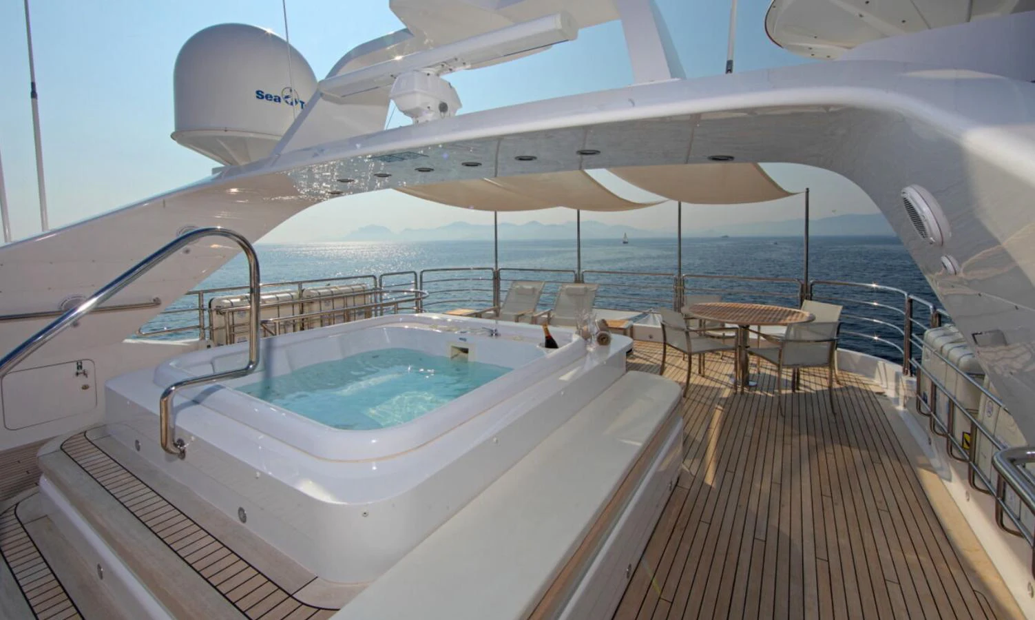 The sundeck features a luxurious jacuzzi with stunning ocean views. aboard SEA SHELL Yacht for Sale