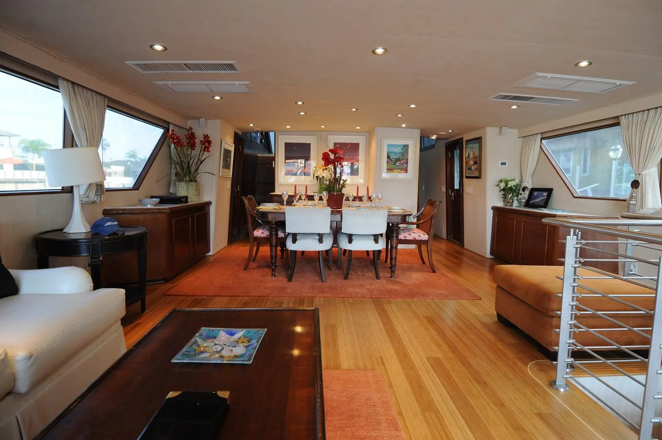 The yacht's dining area features elegant furnishings and ample natural light. aboard BURNING DAYLIGHT Yacht for Sale