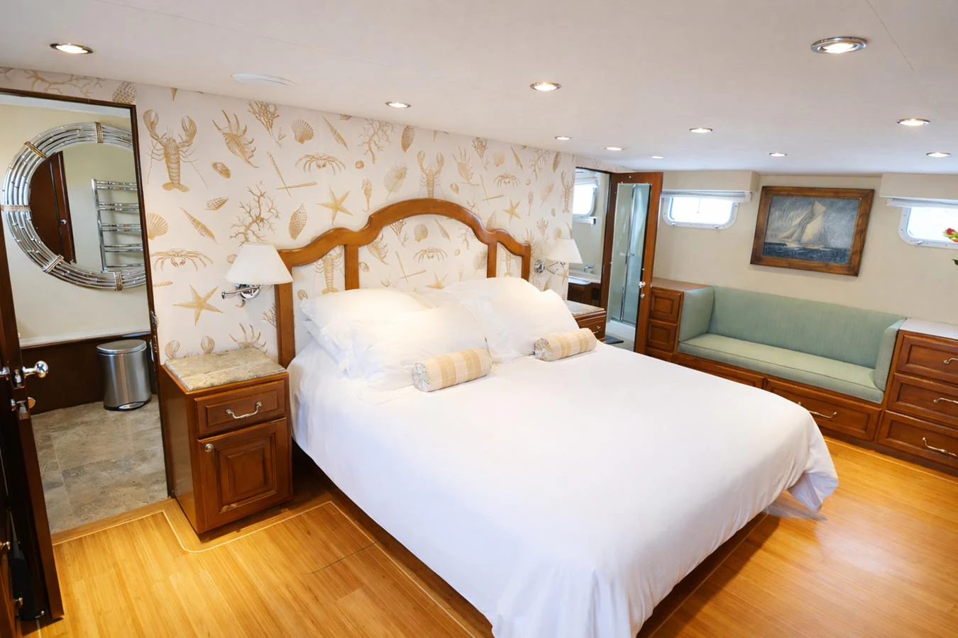 The master stateroom features a spacious bed, elegant decor, and ample natural light. aboard BURNING DAYLIGHT Yacht for Sale
