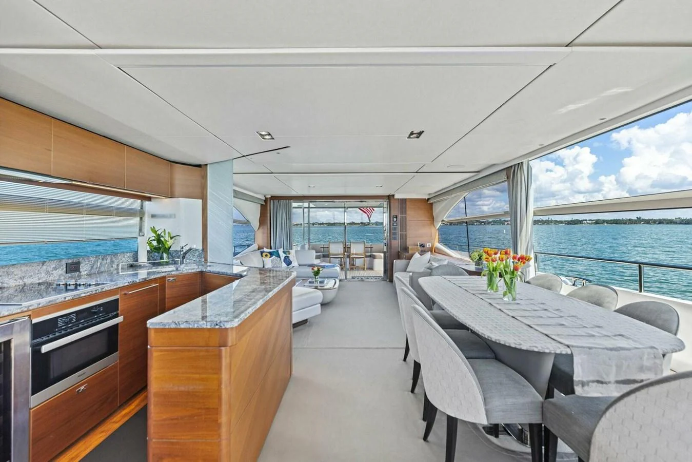 The salon features a spacious open-plan layout with elegant furnishings and panoramic views. aboard 3BBOYS Yacht for Sale