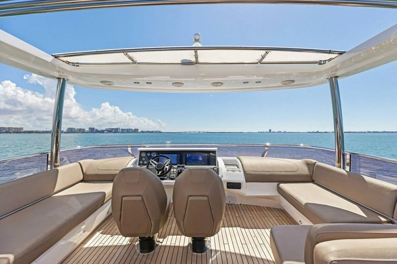 The helm area offers panoramic views and comfortable seating, perfect for navigating in style. aboard 3BBOYS Yacht for Sale