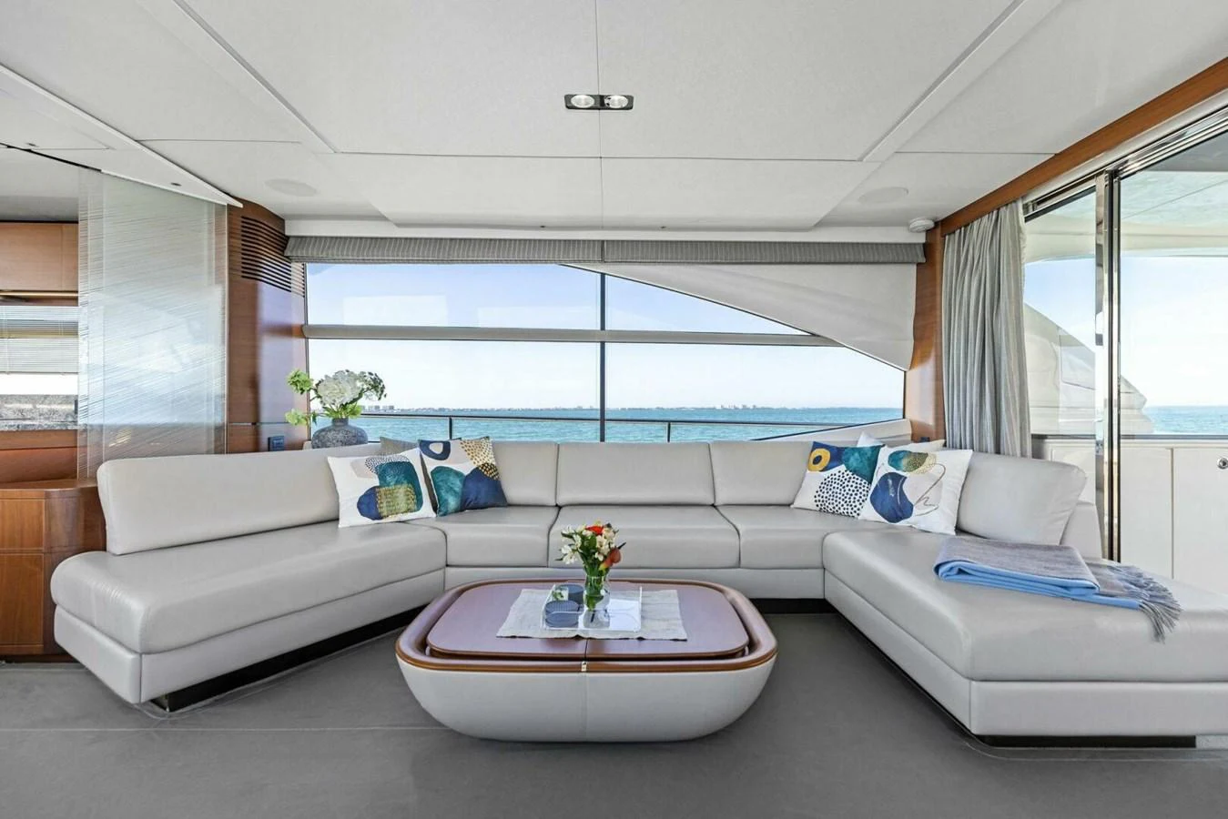 The salon features a spacious seating area with panoramic views of the sea. aboard 3BBOYS Yacht for Sale