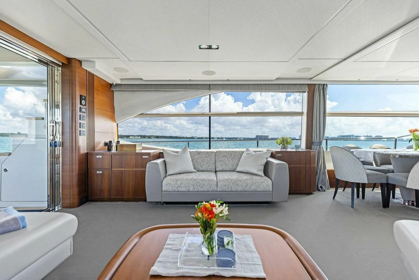 The salon offers a spacious and elegant area with large windows providing stunning views of the sea. aboard 3BBOYS Yacht for Sale