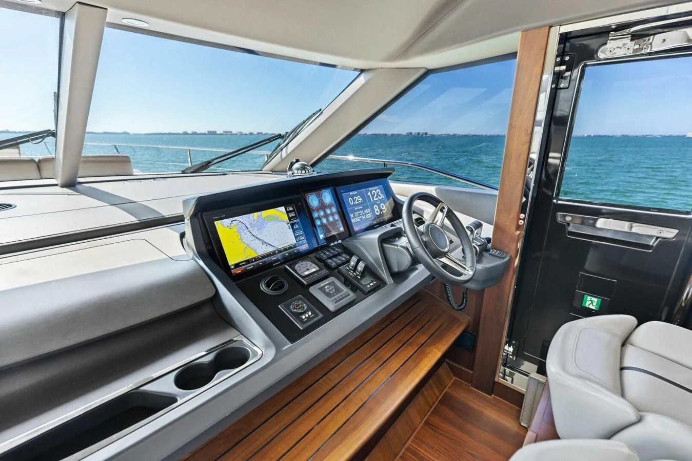 The helm station offers a modern and sleek design with advanced navigation equipment and a panoramic view of the sea. aboard 3BBOYS Yacht for Sale