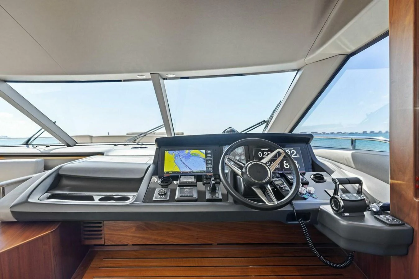 The helm station offers a sleek and modern design with advanced navigation equipment and panoramic views. aboard 3BBOYS Yacht for Sale
