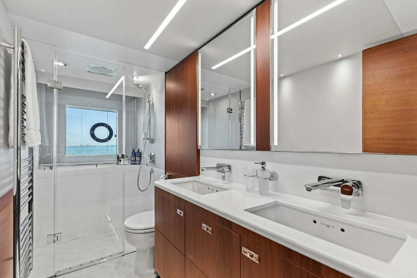 The yacht's bathroom features modern fixtures and a spacious shower area. aboard 3BBOYS Yacht for Sale