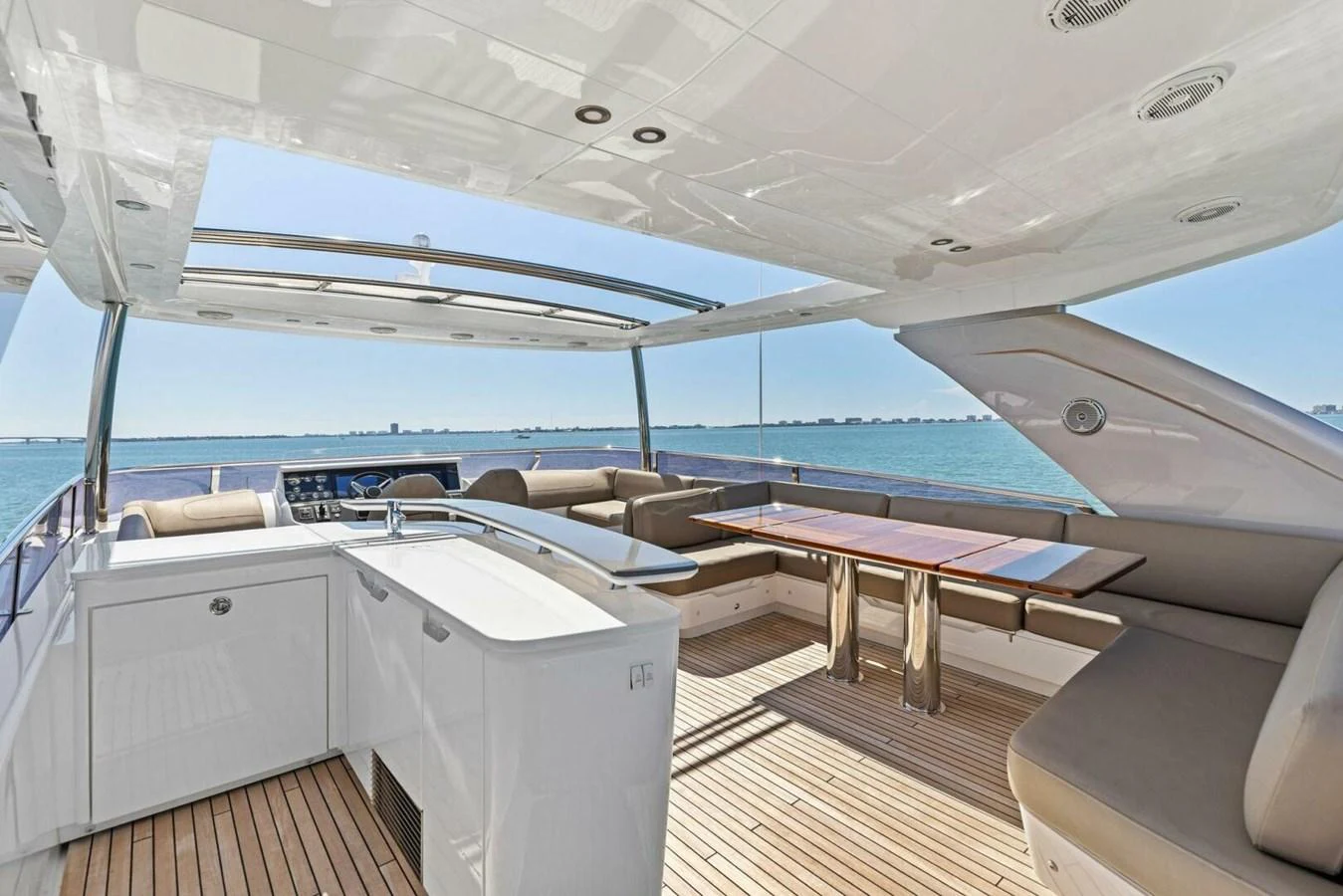 The flybridge offers a spacious and luxurious outdoor living area with stunning sea views. aboard 3BBOYS Yacht for Sale