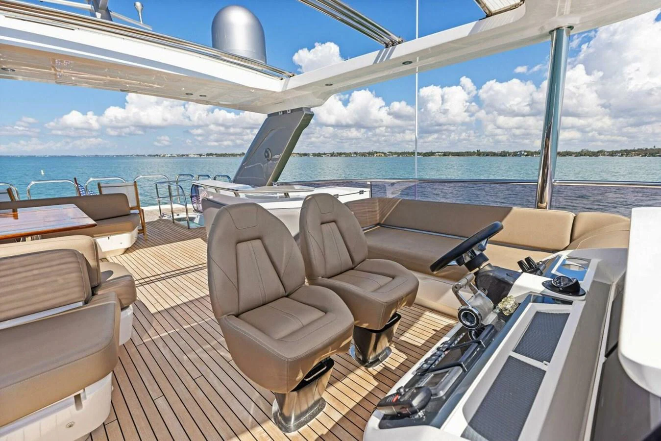 The flybridge offers a spacious and luxurious area with comfortable seating and a helm station, perfect for enjoying the open sea. aboard 3BBOYS Yacht for Sale