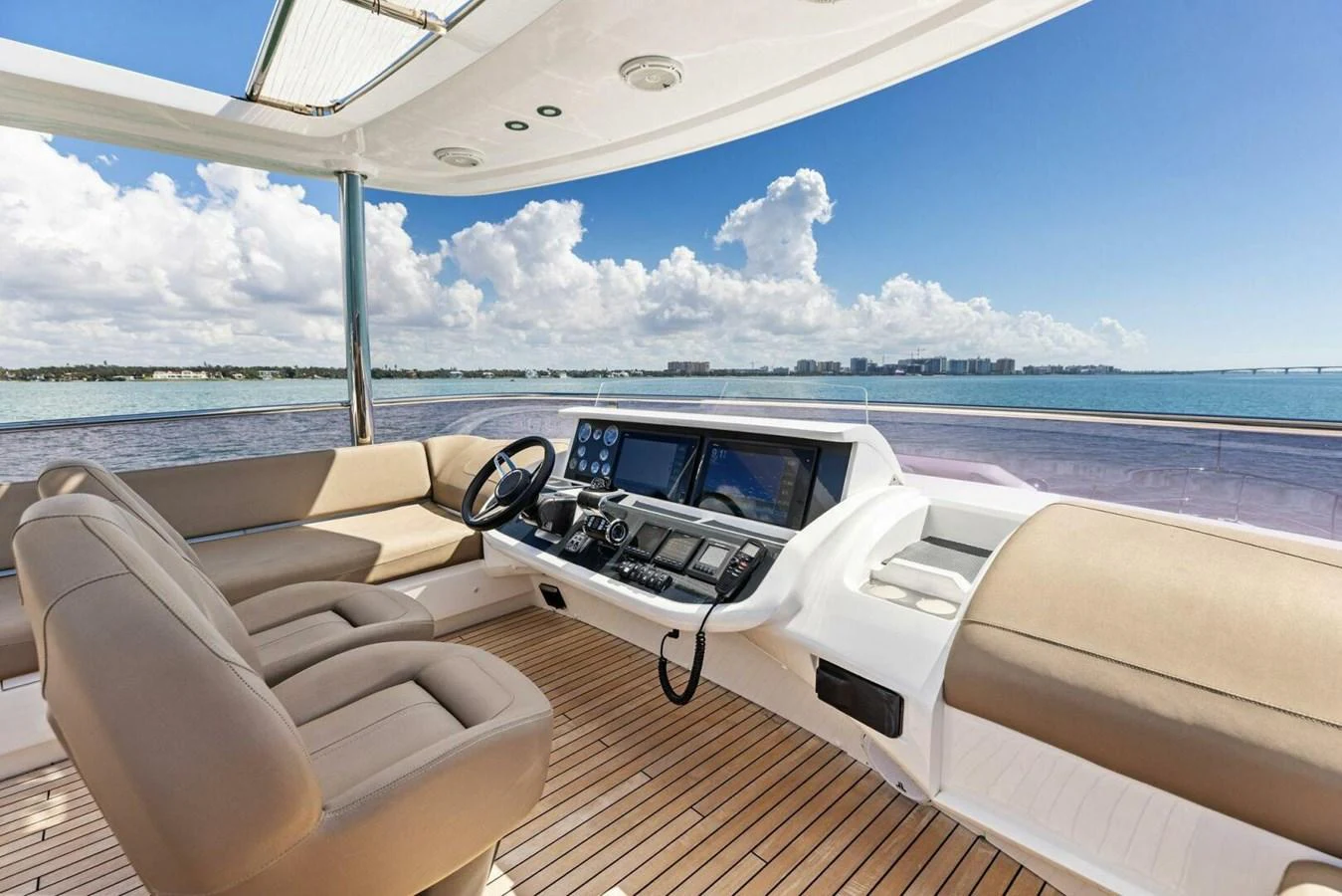 The helm station offers a panoramic view with comfortable seating and advanced navigation equipment. aboard 3BBOYS Yacht for Sale