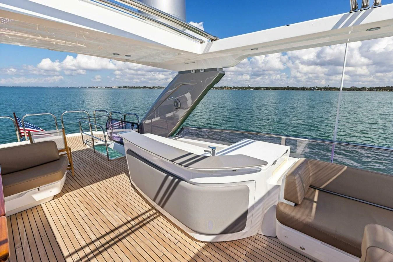 The flybridge offers a spacious and inviting area with comfortable seating and a sleek bar, perfect for enjoying the view. aboard 3BBOYS Yacht for Sale