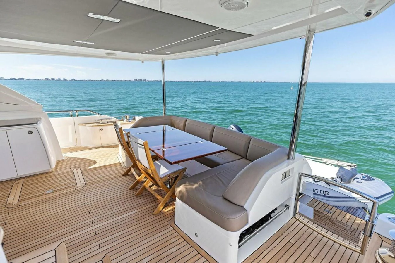 The aft deck offers a comfortable seating area with a stunning ocean view. aboard 3BBOYS Yacht for Sale
