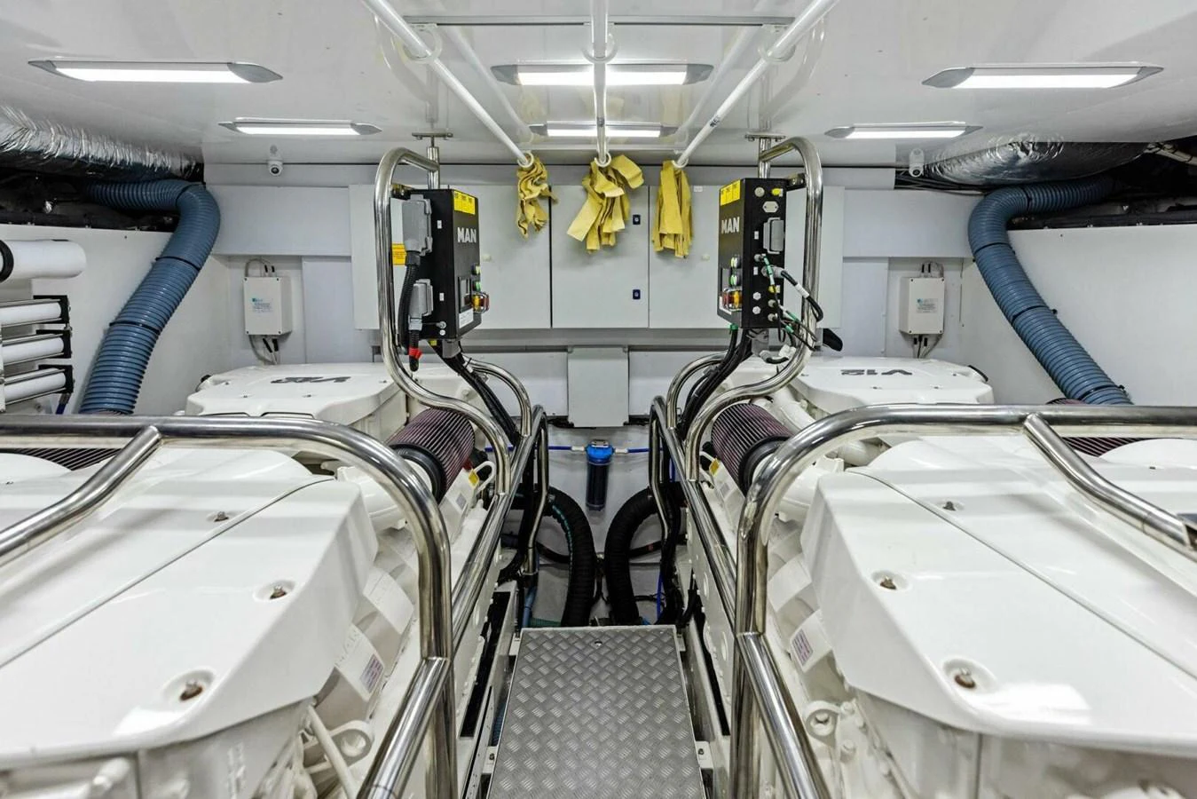 The engine room showcases a pristine and well-organized space with advanced machinery. aboard 3BBOYS Yacht for Sale