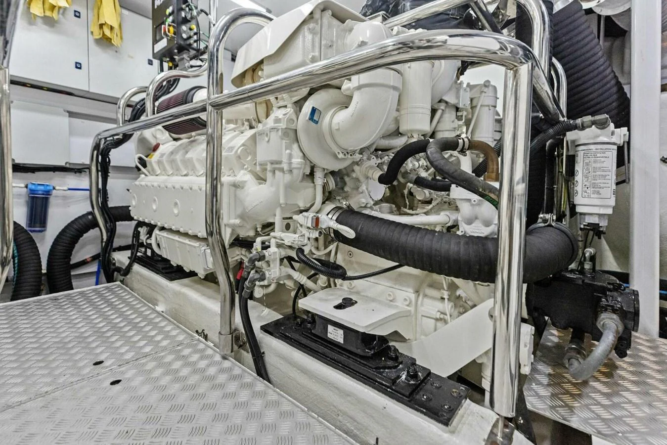The image showcases the yacht's pristine engine room with a powerful engine and well-organized components. aboard 3BBOYS Yacht for Sale