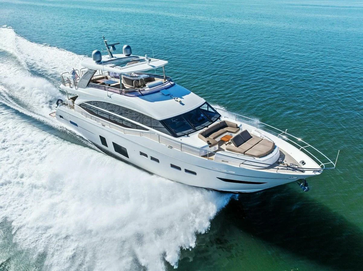 A sleek and modern yacht cruises swiftly over clear blue waters, showcasing its elegant design and luxurious amenities. aboard 3BBOYS Yacht for Sale
