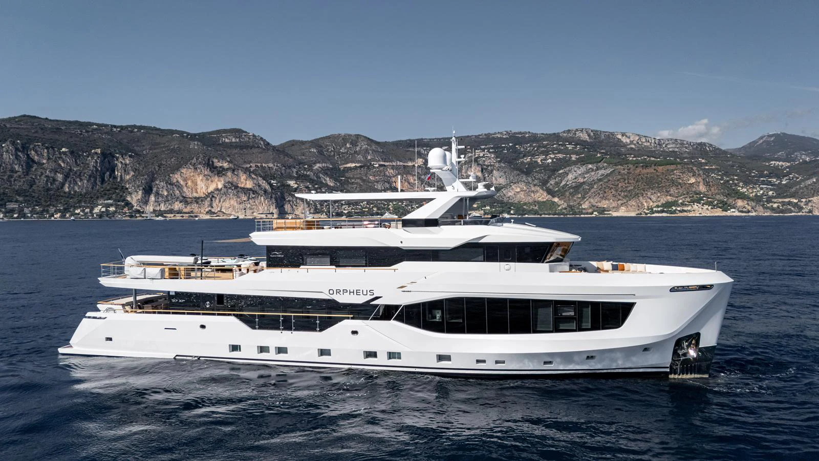A sleek and modern yacht cruising along a scenic coastline. aboard NUMARINE 37XP-21 Yacht for Sale