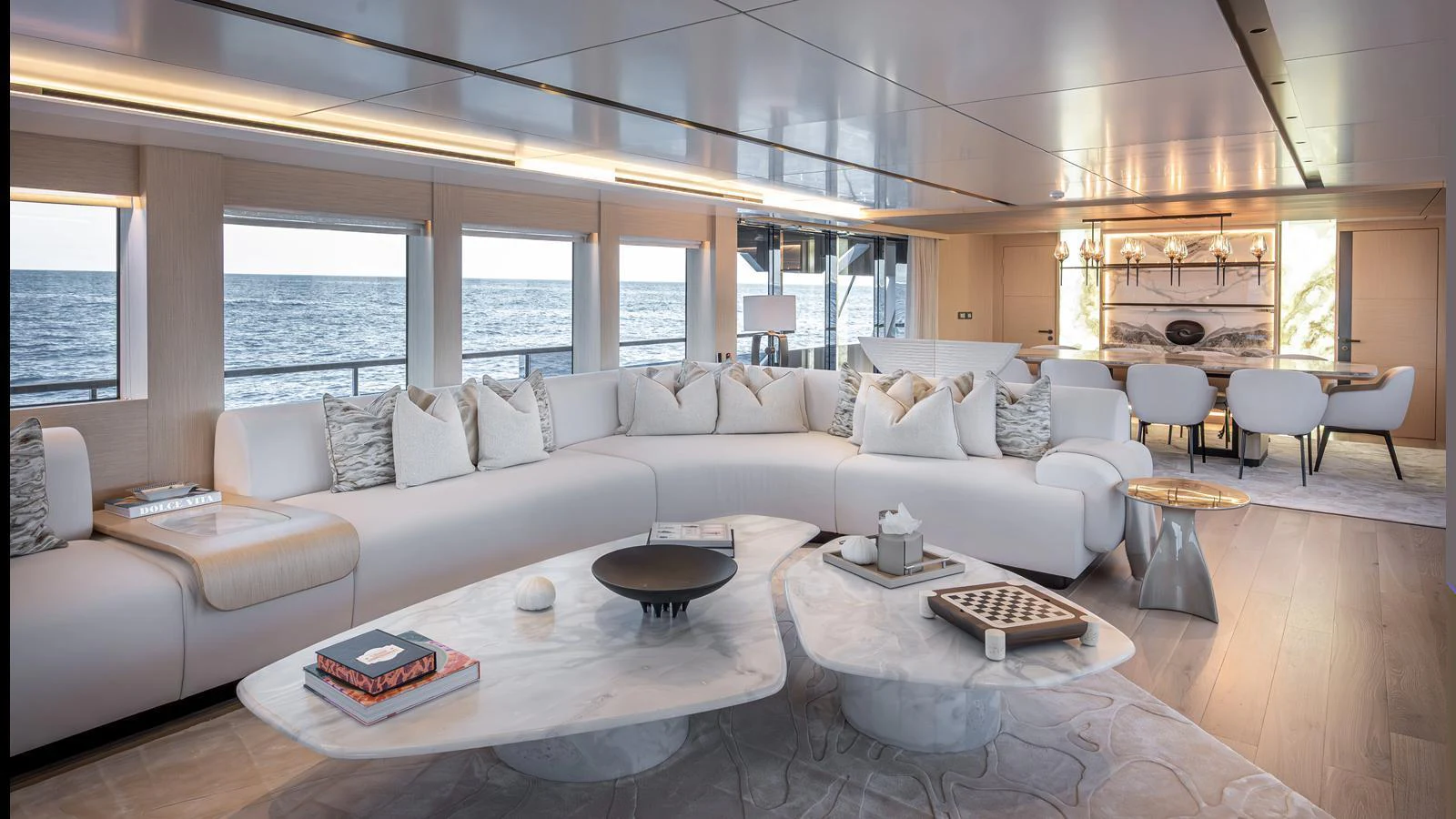 The salon features a spacious and elegant seating area with panoramic ocean views. aboard NUMARINE 37XP-21 Yacht for Sale