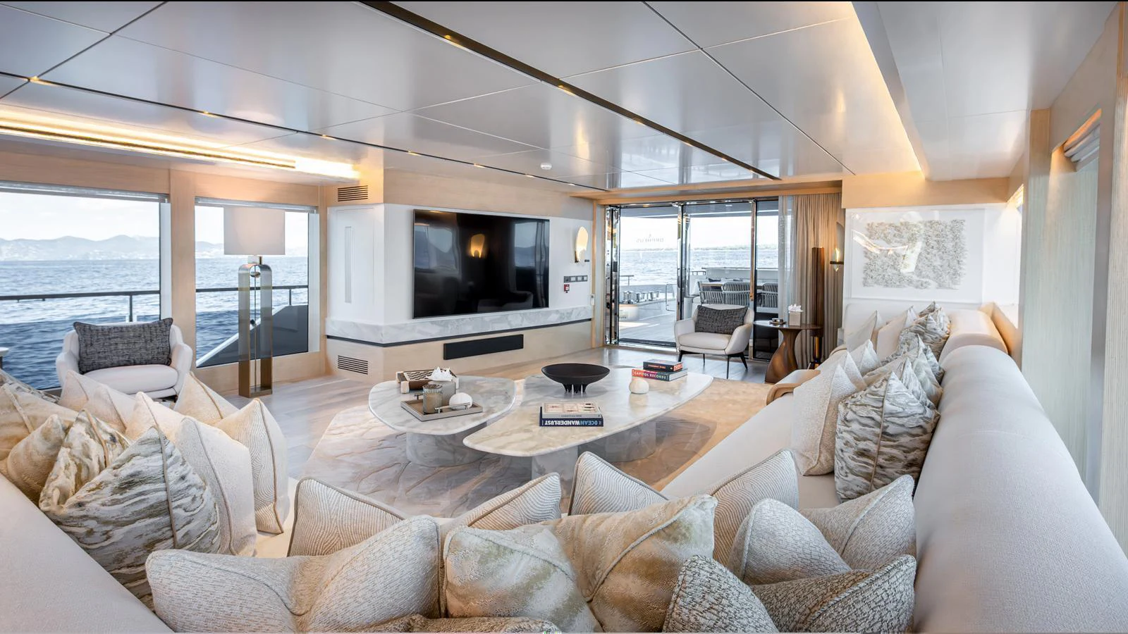 The spacious salon offers luxurious seating with panoramic ocean views. aboard NUMARINE 37XP-21 Yacht for Sale