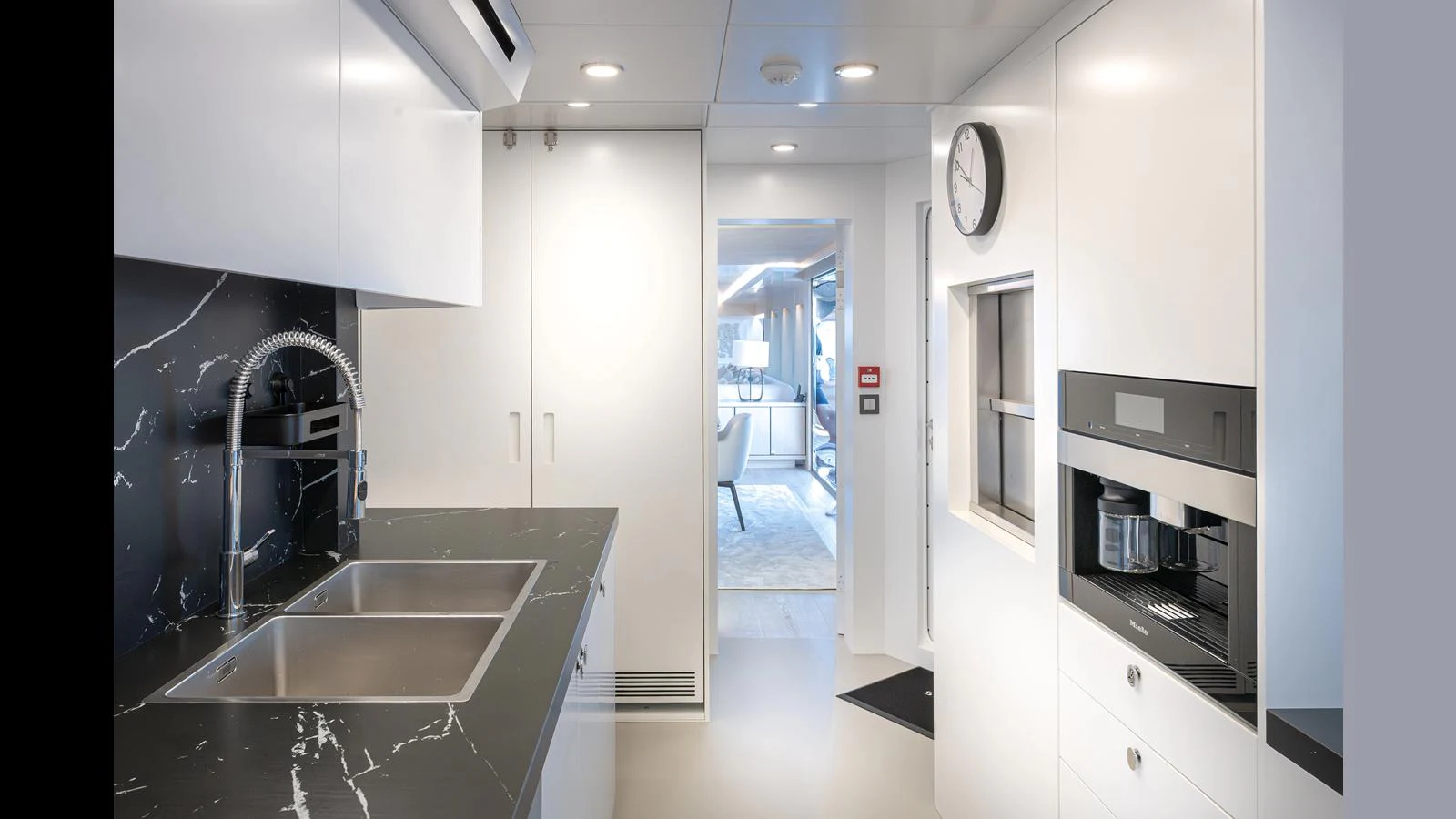 The yacht's galley features modern appliances and sleek design, perfect for gourmet meal preparation. aboard NUMARINE 37XP-21 Yacht for Sale