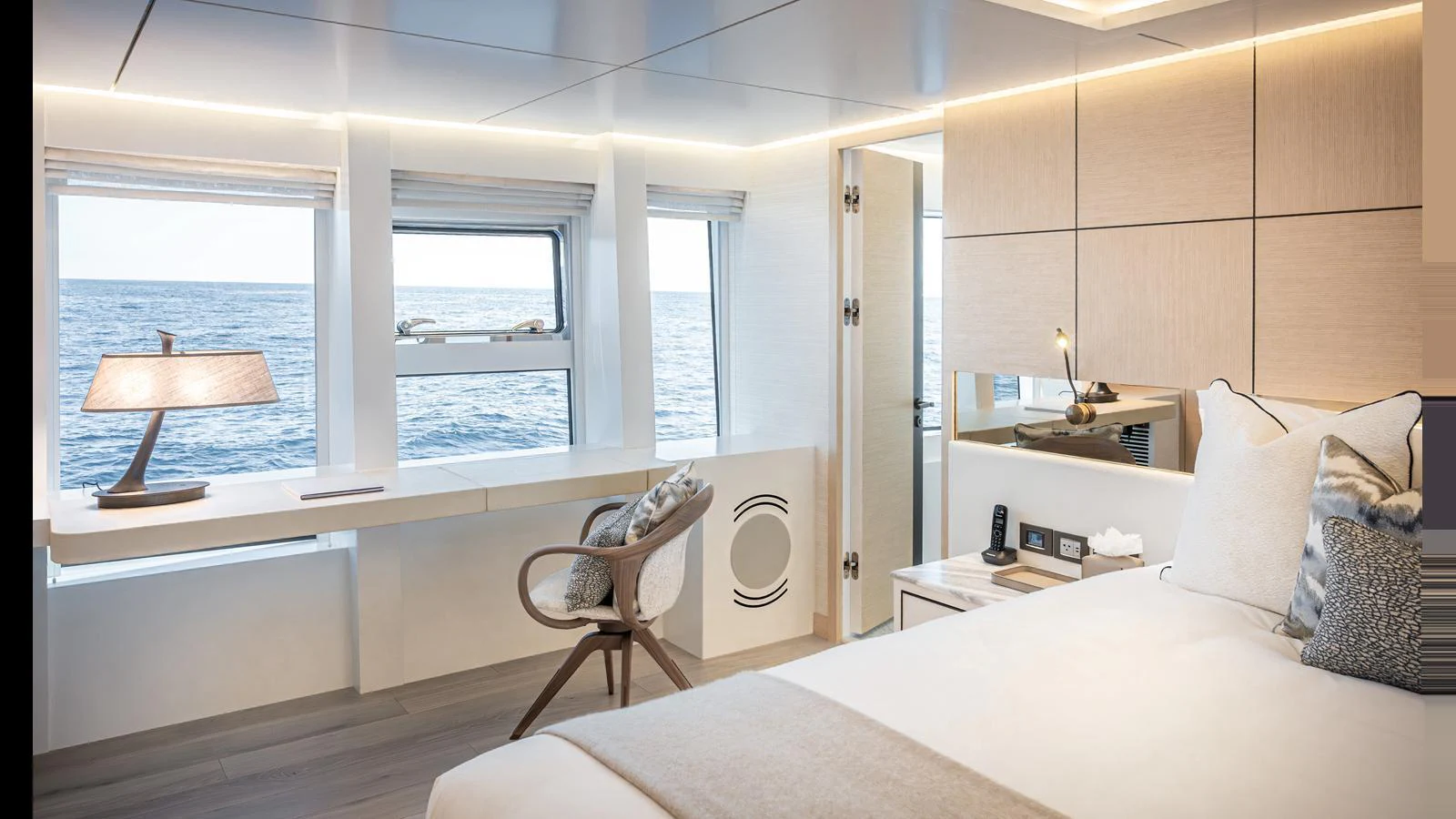 A luxurious stateroom with large windows offering a stunning ocean view. aboard NUMARINE 37XP-21 Yacht for Sale