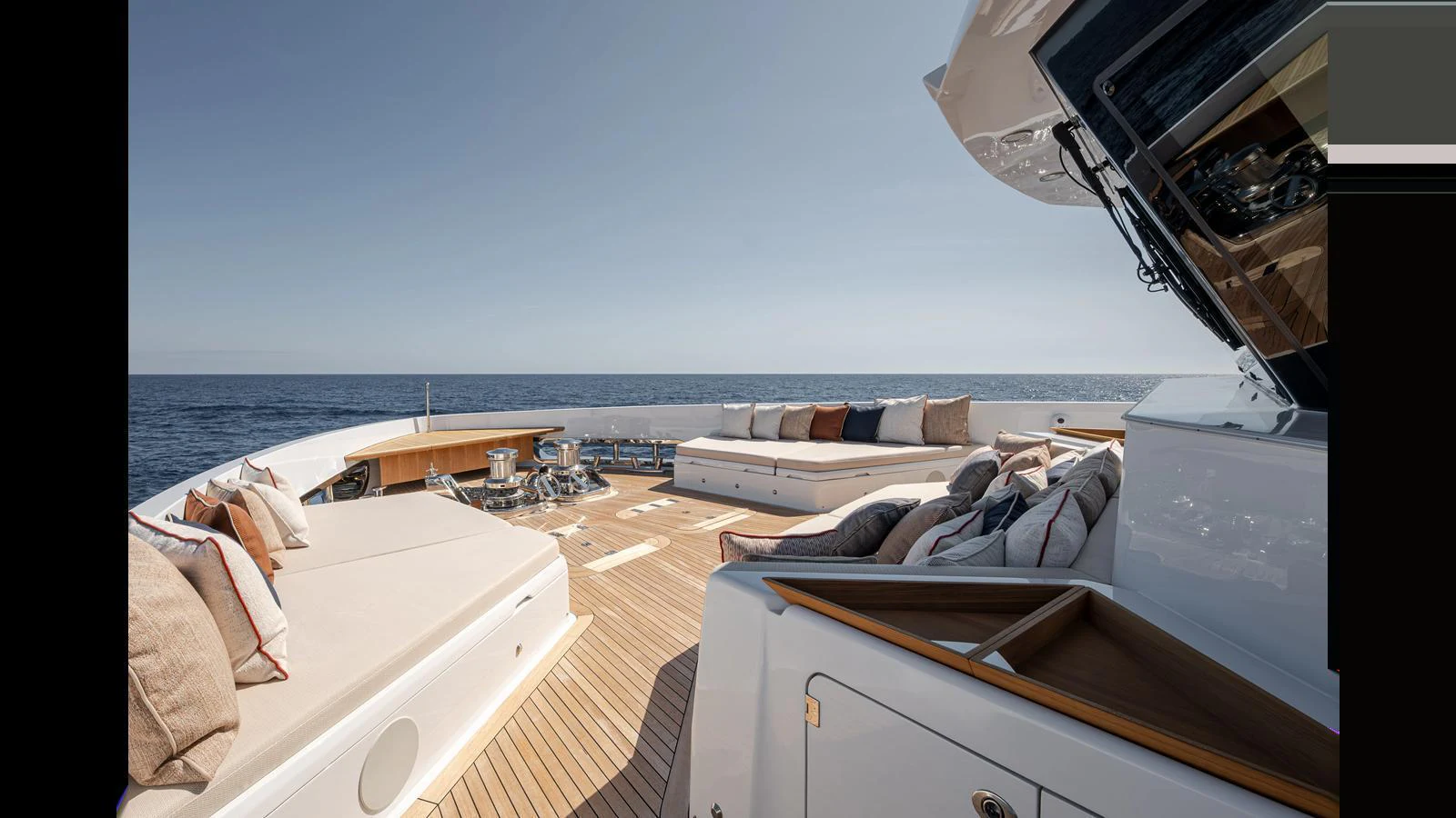 The foredeck features luxurious sun pads and ample seating, perfect for relaxation and enjoying the ocean views. aboard NUMARINE 37XP-21 Yacht for Sale