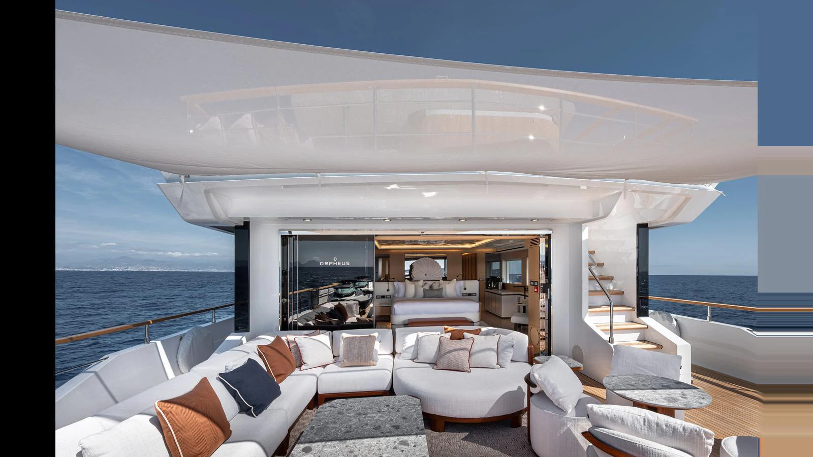 The aft deck offers a luxurious outdoor seating area with plush cushions and a stunning ocean view. aboard NUMARINE 37XP-21 Yacht for Sale