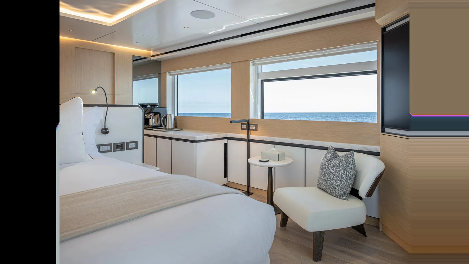 The stateroom features a serene and luxurious design with a stunning ocean view. aboard NUMARINE 37XP-21 Yacht for Sale