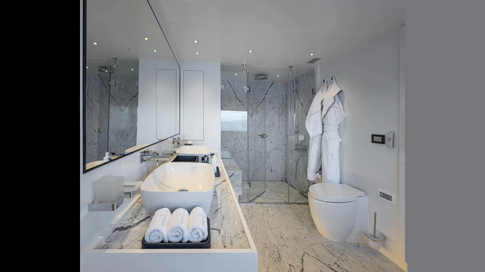 The yacht's bathroom features a sleek, modern design with luxurious marble finishes and high-end fixtures. aboard NUMARINE 37XP-21 Yacht for Sale