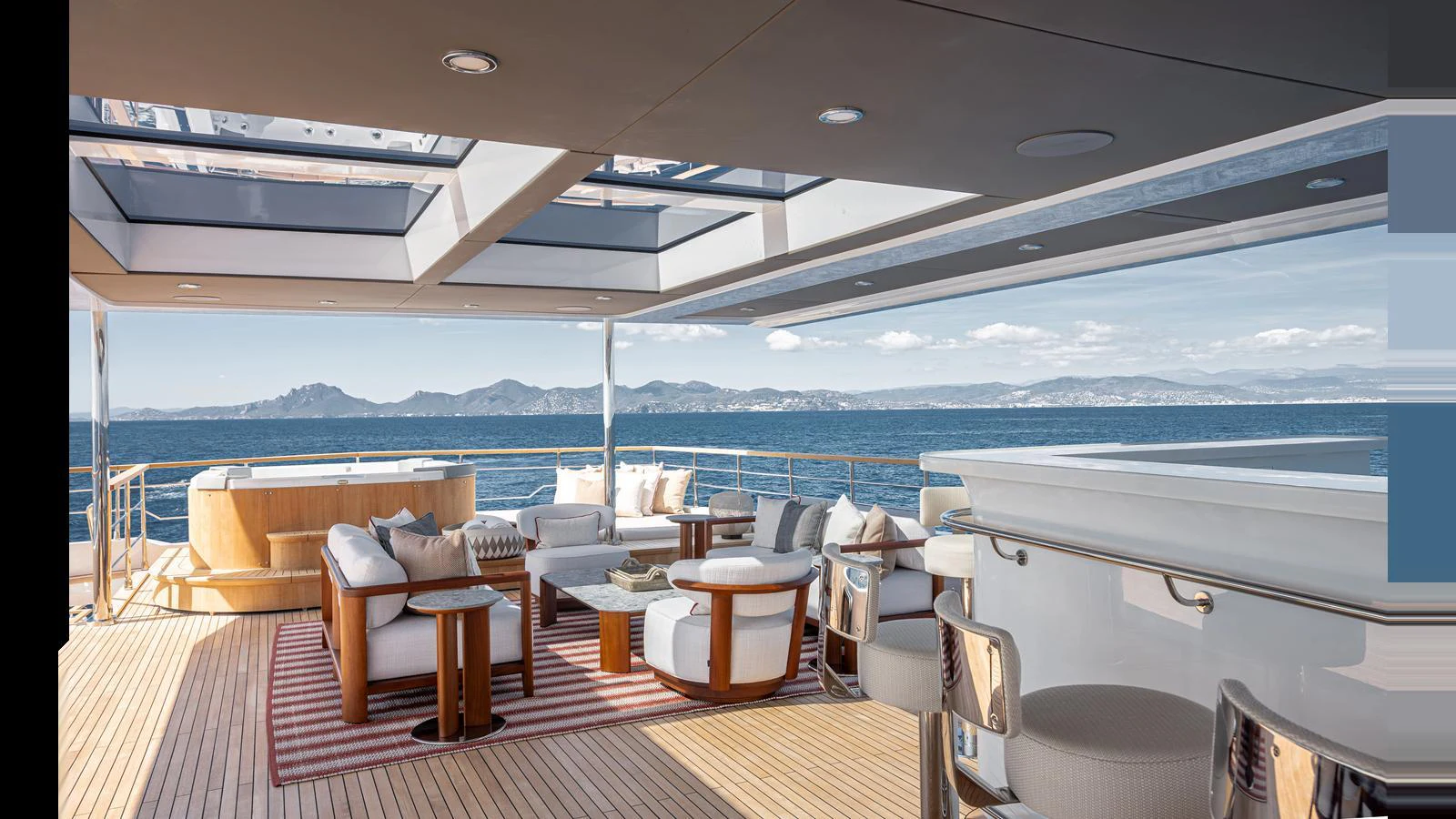The sundeck offers a luxurious outdoor seating area with stunning ocean views. aboard NUMARINE 37XP-21 Yacht for Sale