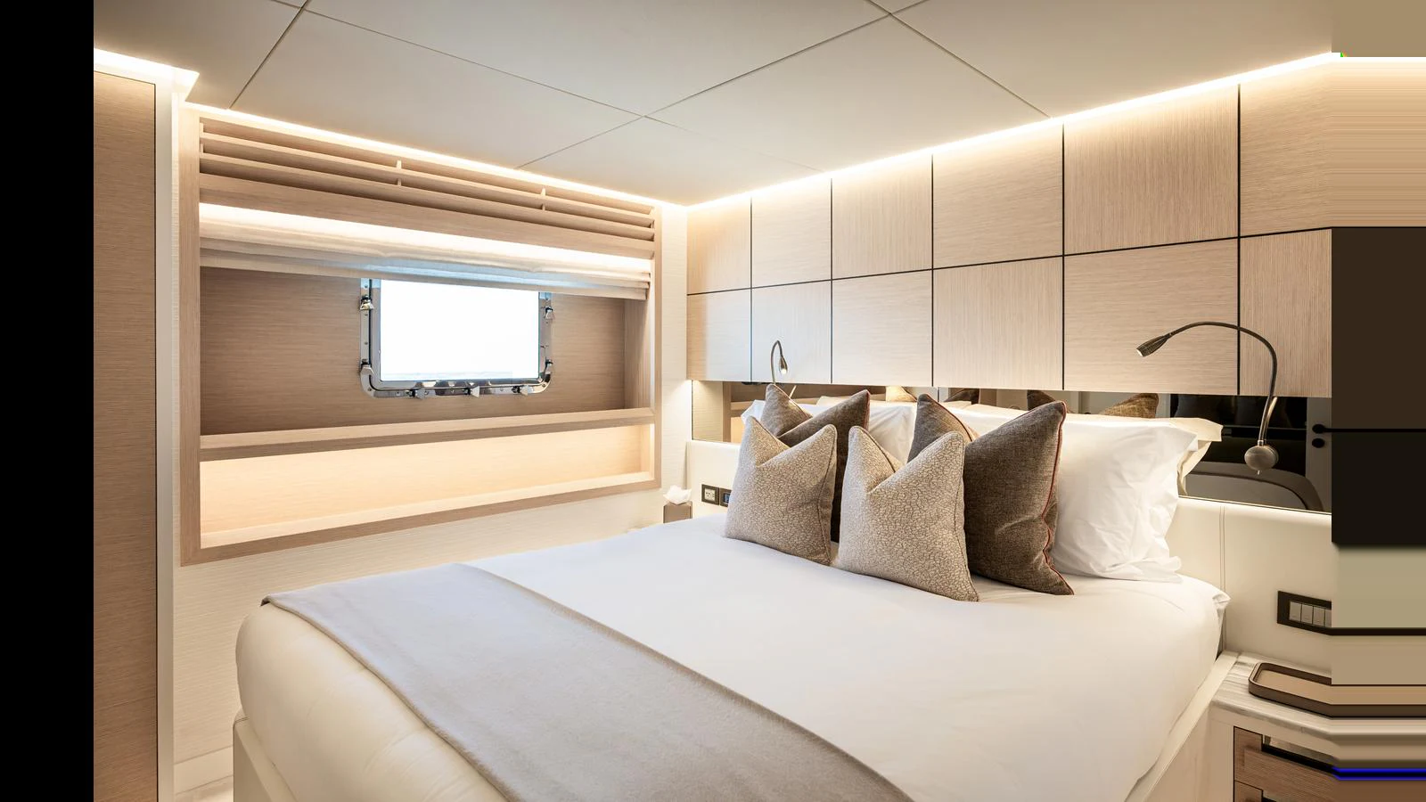 The stateroom features a plush bed with elegant lighting and modern decor. aboard NUMARINE 37XP-21 Yacht for Sale