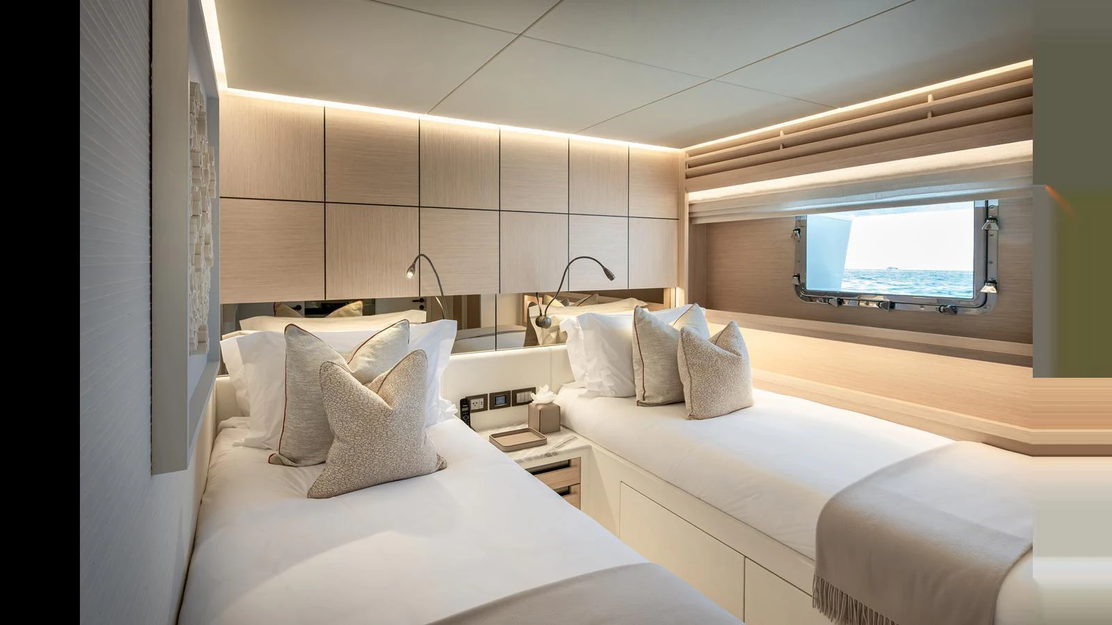 The guest stateroom features twin beds with luxurious linens and a serene ambiance. aboard NUMARINE 37XP-21 Yacht for Sale