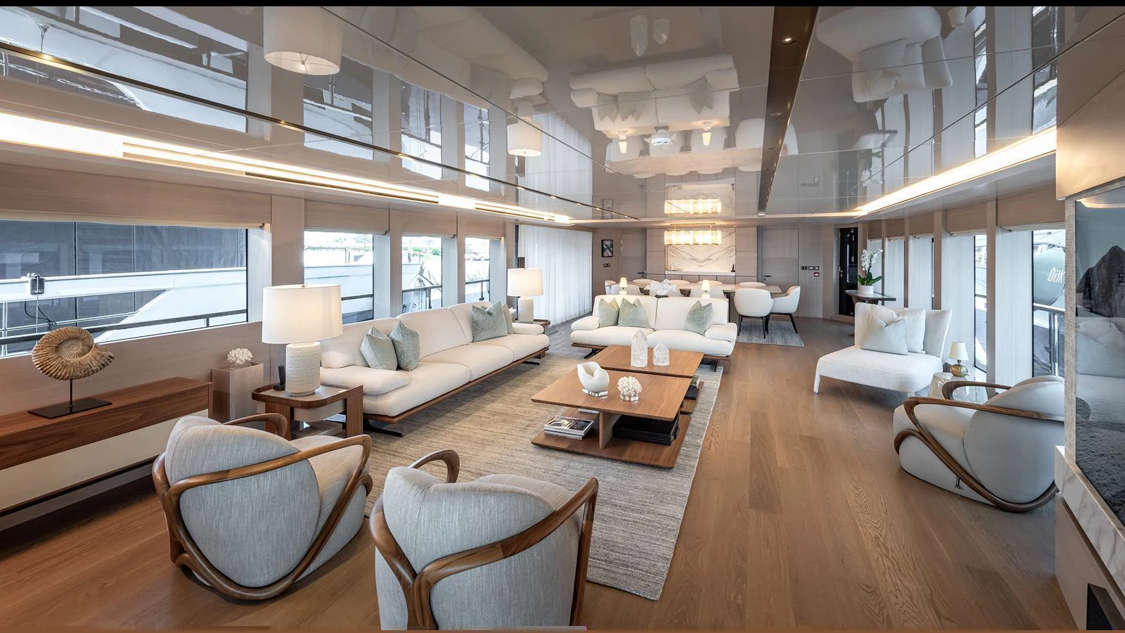 The salon features elegant seating arrangements with modern furnishings and ample natural light. aboard NUMARINE 37XP-21 Yacht for Sale