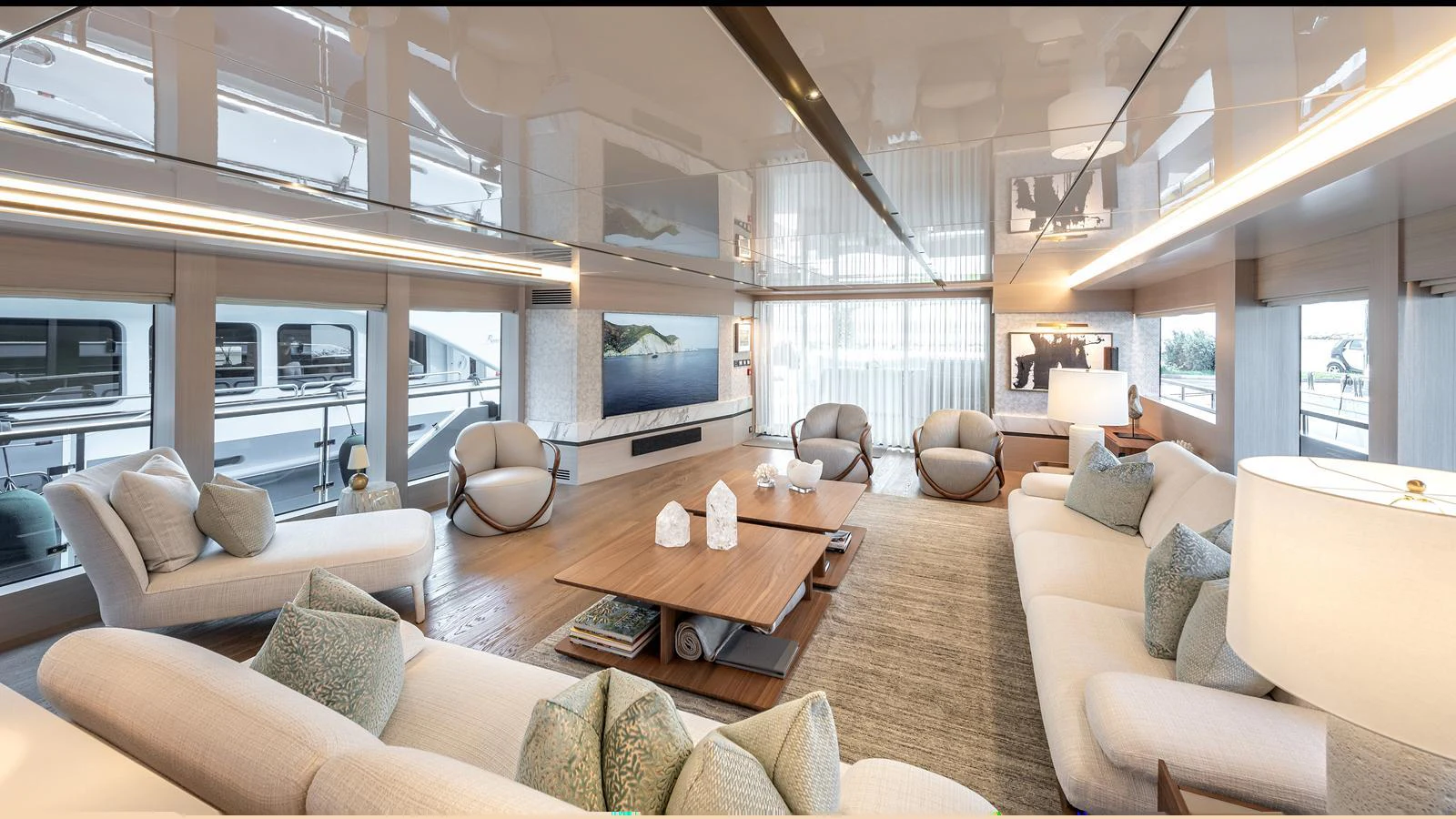 The salon features luxurious seating, modern decor, and expansive windows offering stunning views. aboard NUMARINE 37XP-21 Yacht for Sale