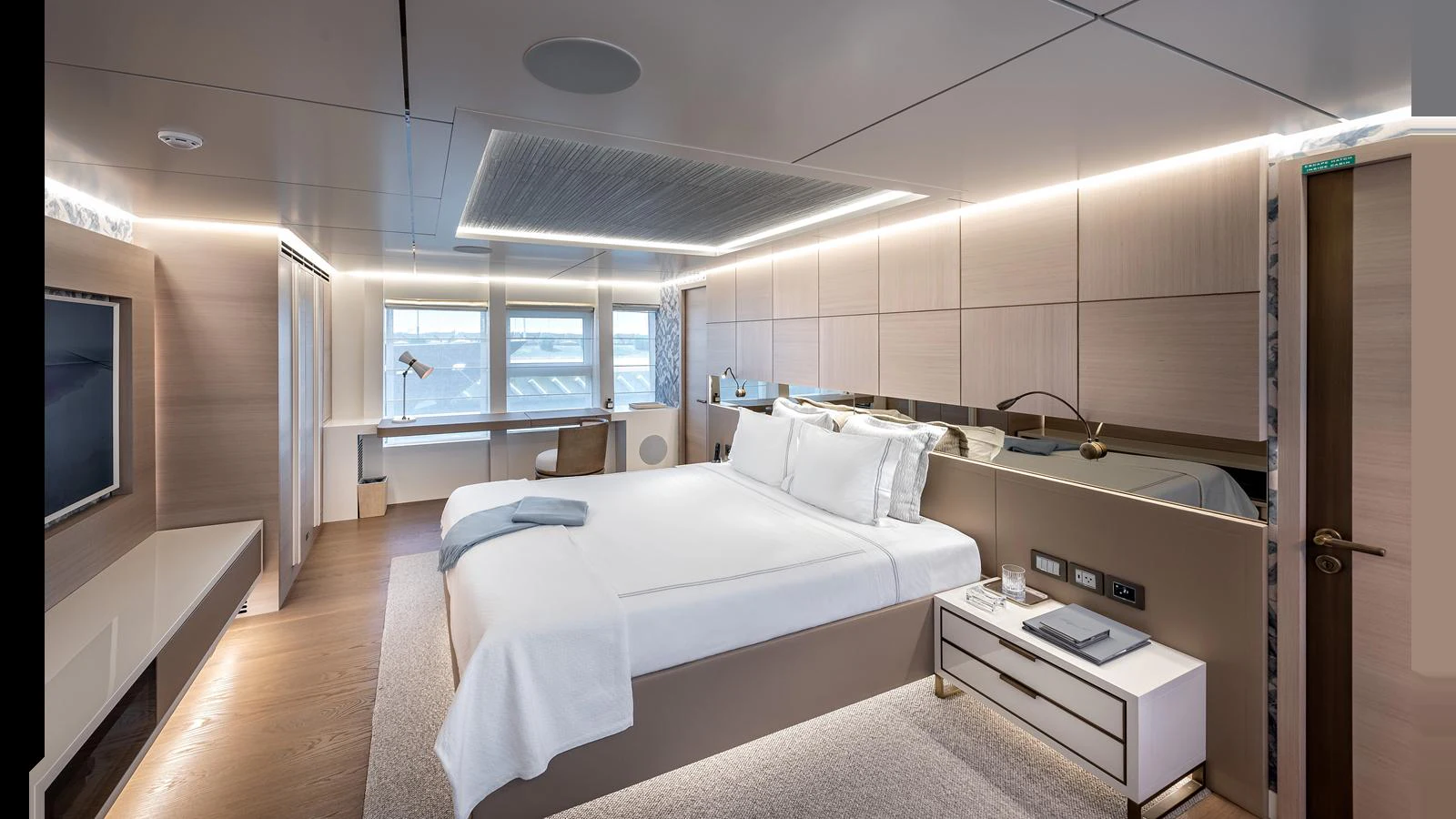 The master stateroom features a spacious bed, modern decor, and ample natural light. aboard NUMARINE 37XP-21 Yacht for Sale