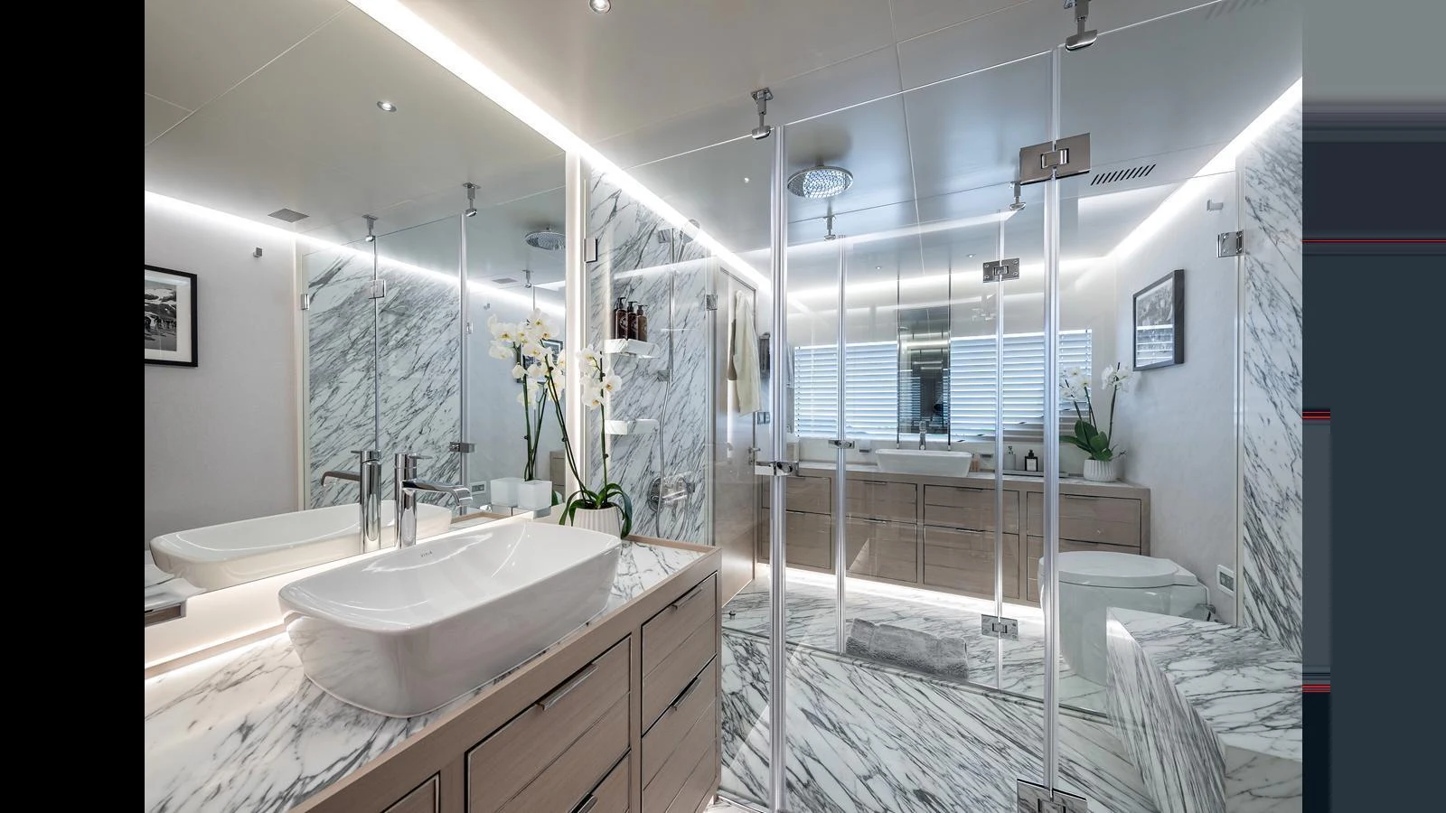 The yacht's bathroom features luxurious marble finishes and modern fixtures. aboard NUMARINE 37XP-21 Yacht for Sale