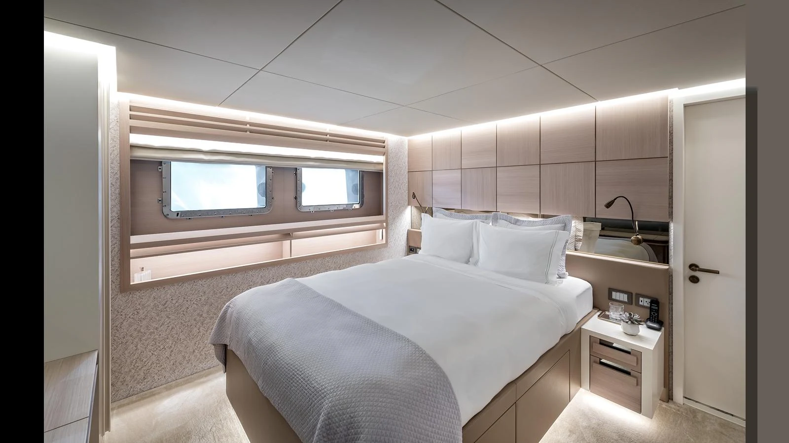 The stateroom features a luxurious bed with modern lighting and ample storage. aboard NUMARINE 37XP-21 Yacht for Sale