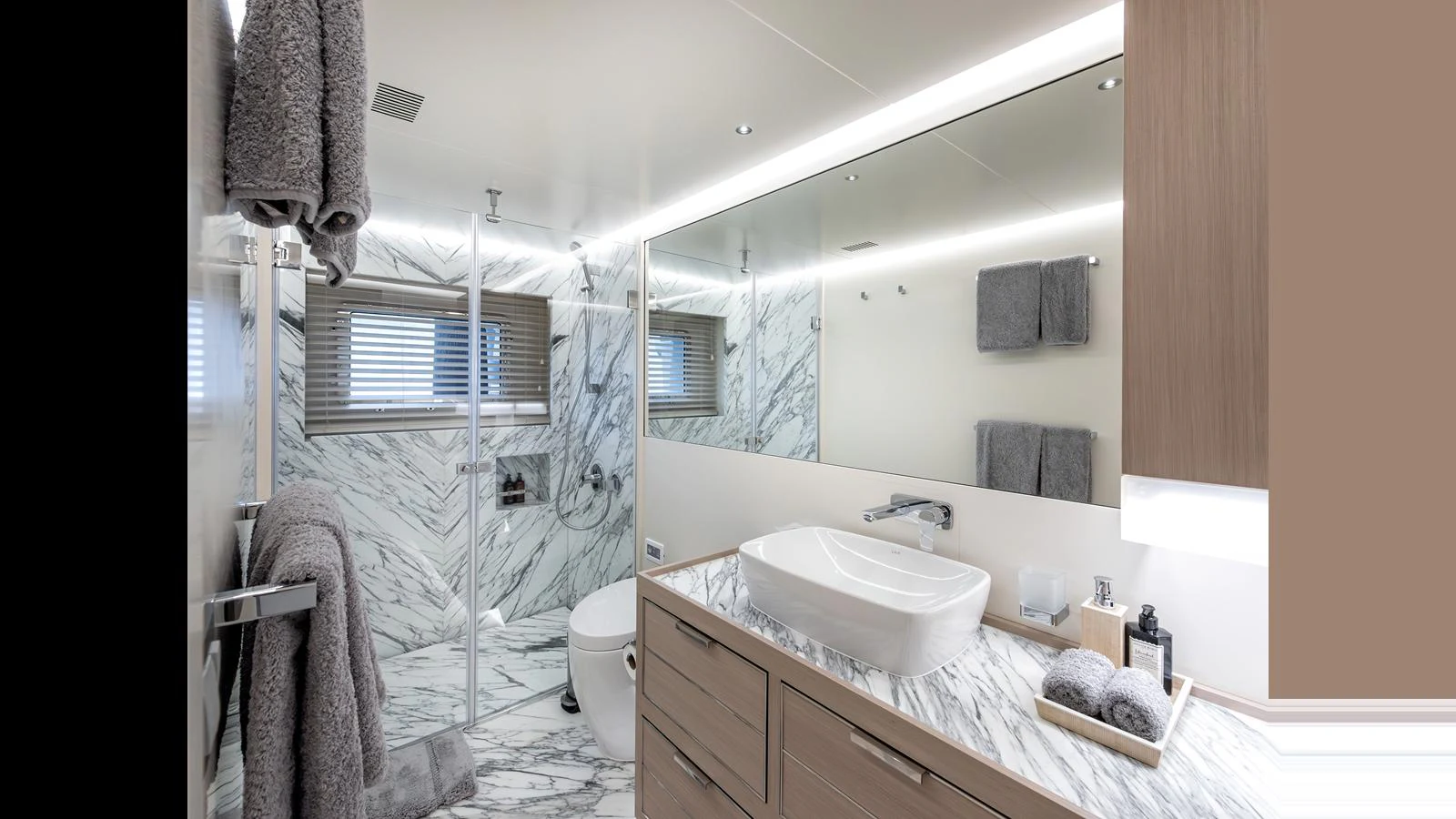 The yacht's bathroom features elegant marble surfaces and modern fixtures, creating a luxurious and serene atmosphere. aboard NUMARINE 37XP-21 Yacht for Sale