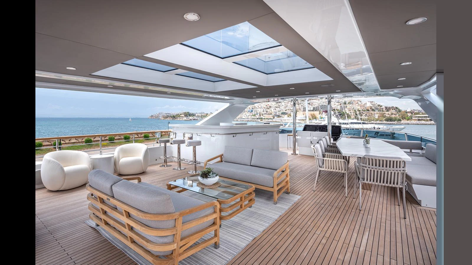 The aft deck features luxurious seating and dining areas with panoramic views. aboard NUMARINE 37XP-21 Yacht for Sale