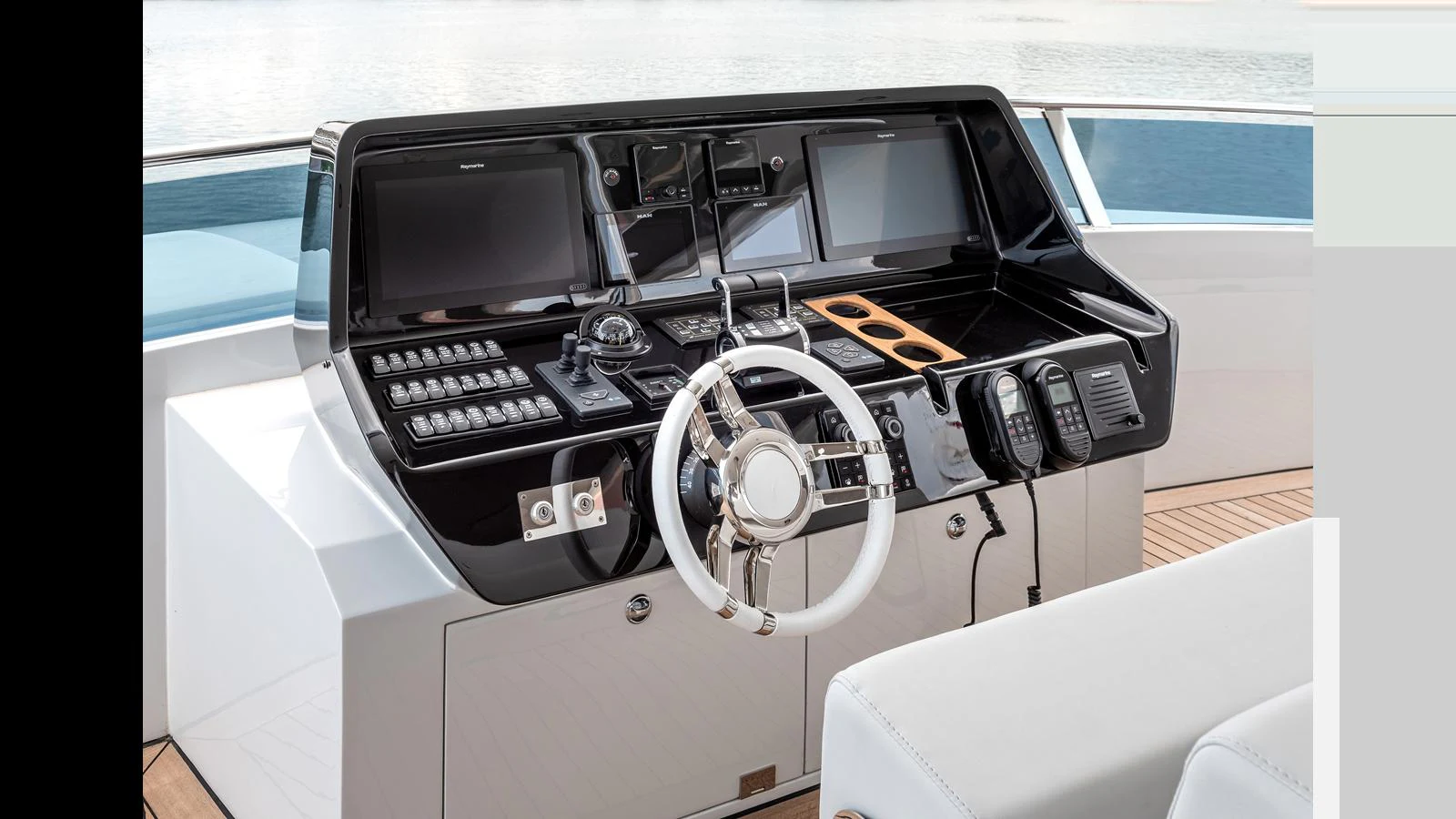 The helm station features state-of-the-art navigation equipment and a sleek, modern design. aboard NUMARINE 37XP-21 Yacht for Sale