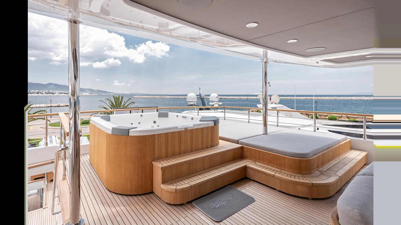 The yacht's deck features a luxurious jacuzzi with stunning sea views. aboard NUMARINE 37XP-21 Yacht for Sale