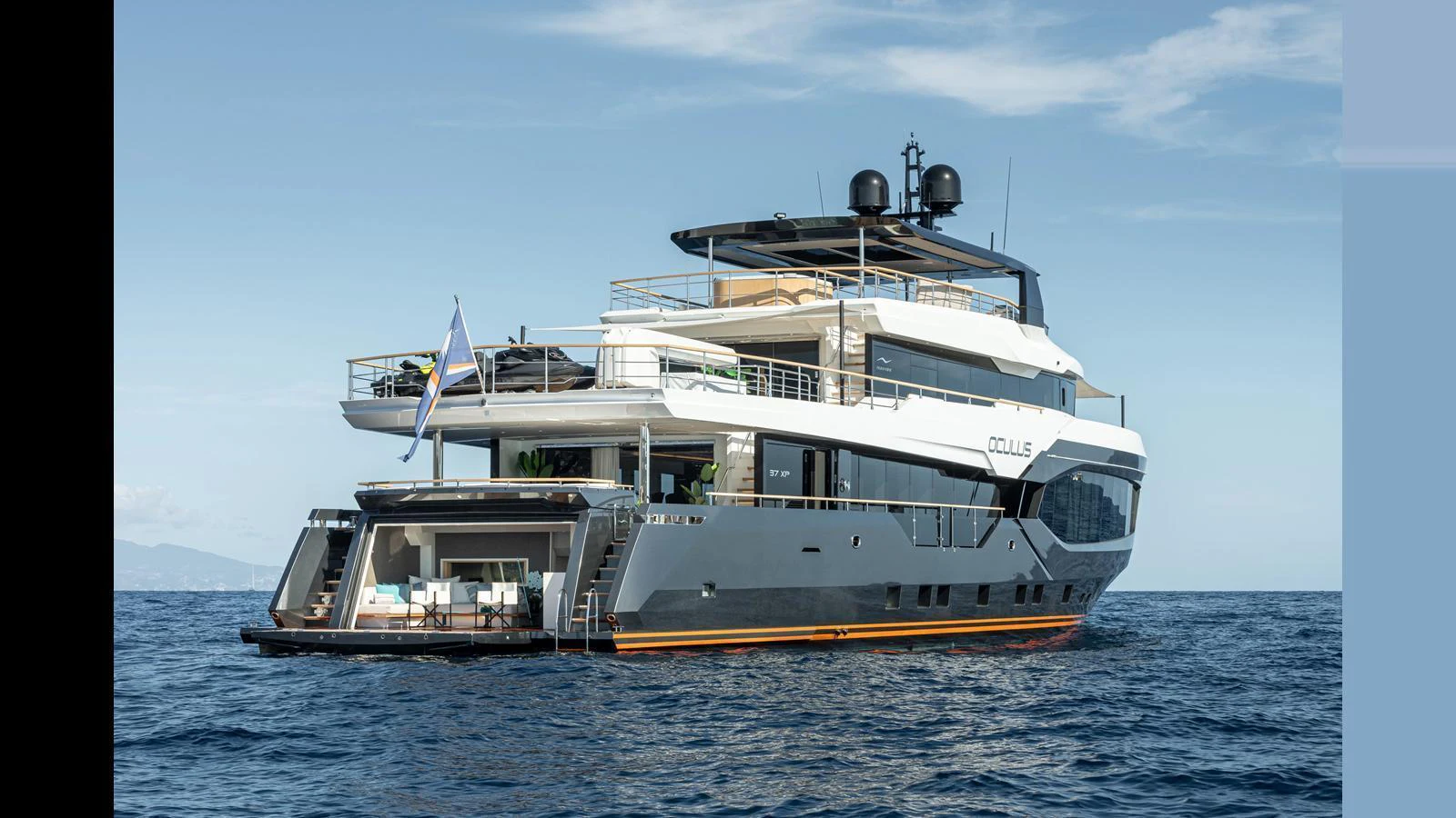 A luxurious yacht cruising on calm waters under a clear sky. aboard NUMARINE 37XP-21 Yacht for Sale